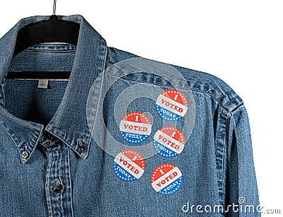 Blue denim working clothing with many Voted stickers on white background Stock Photo