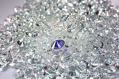 Blue diamonds are placed on a pile of white diamonds Stock Photo
