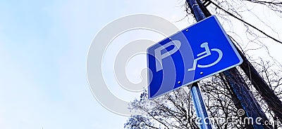 Handicap parking sign for disabled people shot from frog perspective Stock Photo