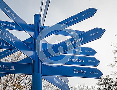 Blue distance pointer travel destination in vintage style ootdoor. Stock Photo