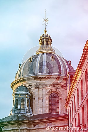 Blue dome under golden sunset light in Paris, France. Golden details glow under the golden light. Colored light leaks on Stock Photo