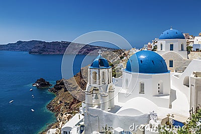 Blue domed churches in the village of Oia, Santorini Thira, Cyclades Islands, Aegean Sea, Stock Photo