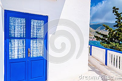 Blue door in front of Greek house, Greece Stock Photo