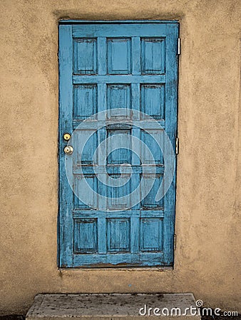 Blue Door, Mud Wall Stock Photo