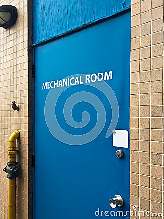 Blue door to a mechanical room Stock Photo