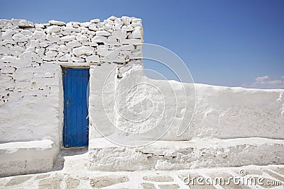 Blue Door and White Stone Wall Stock Photo