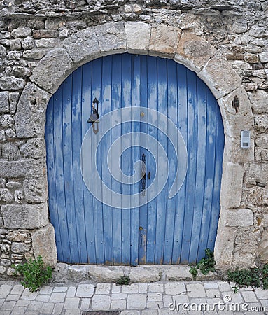 Blue double wing door with bell Stock Photo