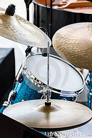 blue drum and copper cymbals standing in street for musical performance Stock Photo