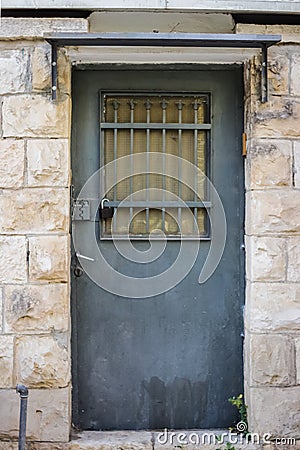 Blue durty, dirty door with rusty and openwork a beautiful vintage background Stock Photo