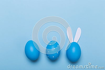 Blue easter eggs in nest on pastel background with space Stock Photo