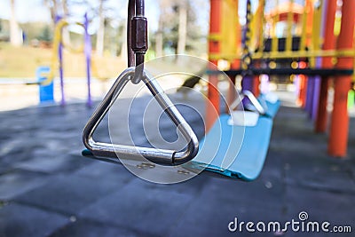 Child swing seat in a colorful playground Stock Photo