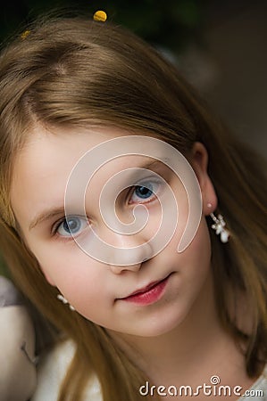 Blue eyed white caucasian young girl portrait Stock Photo
