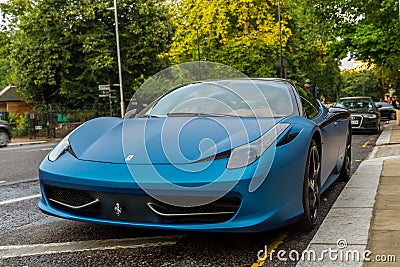 Blue Ferrari 458 parked in street in London Editorial Stock Photo