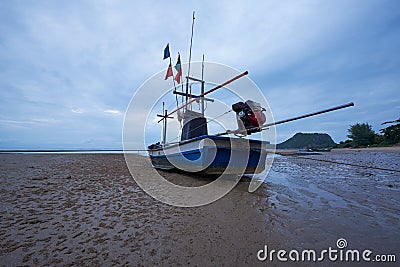 A blue fisherman boat on the beach Stock Photo