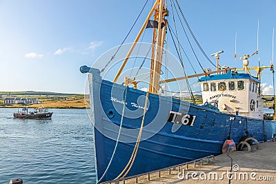 Blue fishing boat in the port Editorial Stock Photo