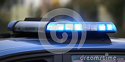 blue flashing of the police car during a chase between cars Stock Photo