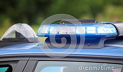 blue flashing of the police car during a chase between cars Stock Photo