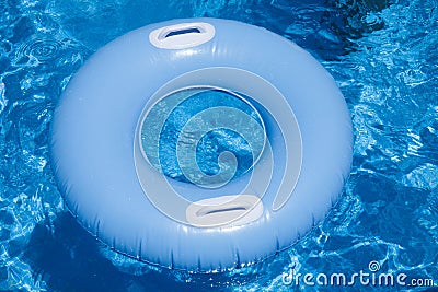 Blue floater with handles in water of pool Stock Photo