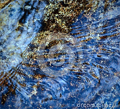 Blue flowing water Stock Photo