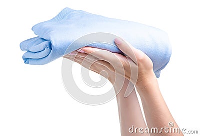 Blue folded sweater clothing in hand Stock Photo
