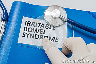 Blue folder with patient files with IBS (Irritable Bowel Syndrome) diagnosis Stock Photo