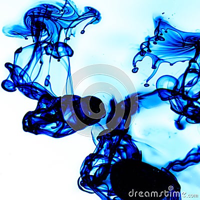 Food coloring dispersing in water Stock Photo