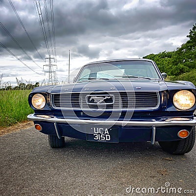 Blue 1966 ford Mustang coupÃ© front view Editorial Stock Photo