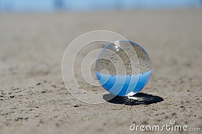 Blue freedom concept: The Crystal Ball reflecting water and sky in blue. Beautiful creative landscape photography Stock Photo