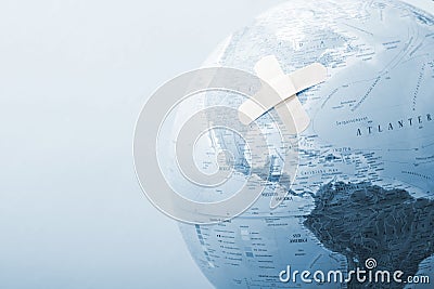 Blue globe with bandages Stock Photo