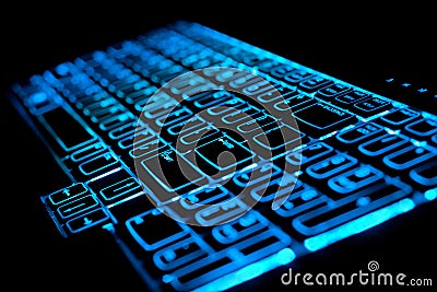 Blue glowing computer laptop keyboard Stock Photo