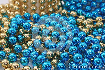 Blue and Gold Holiday Bead Decortations. Christmas Background Stock Photo