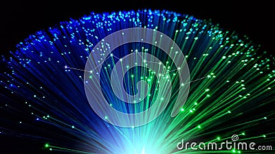 Blue and green optical fiber cables with shining tips Stock Photo
