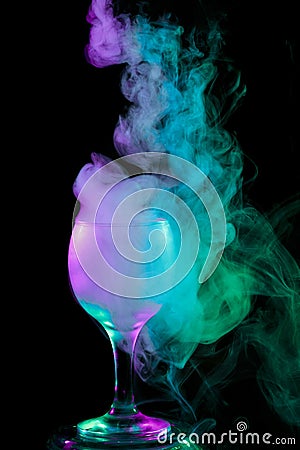 Blue - green - purple smoke in the glass. Halloween. Stock Photo