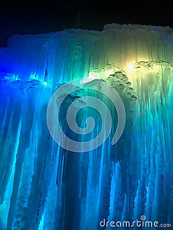 Blue, green, and yellow colored lighted icicles Stock Photo