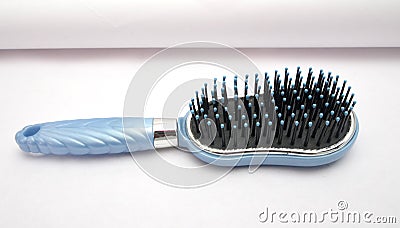 Blue hair comb Stock Photo