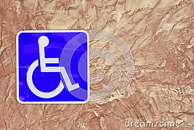 Blue handicap parking or wheelchair on wall brick . Stock Photo