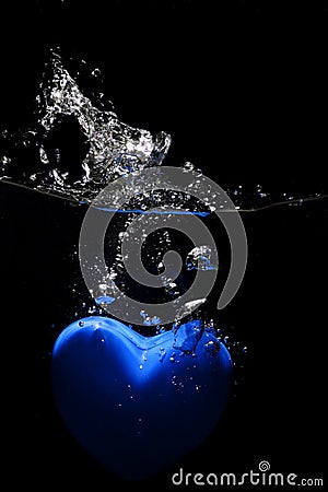 Blue heart splashing on water Stock Photo