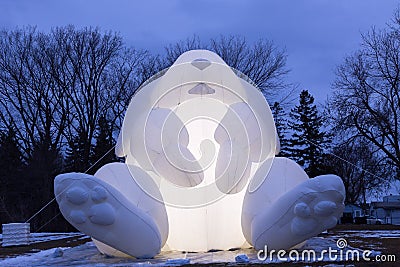 Blue hour low angle view of glowing giant inflatable rabbit Editorial Stock Photo