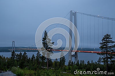 Blue hour picture of illuminated High Coast Bridge. Stock Photo