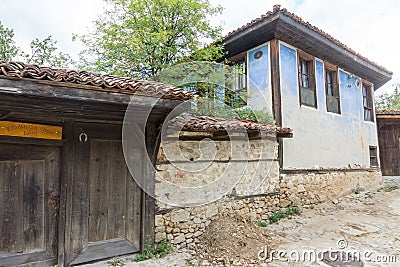 Blue house with wooden gate in Koprivshtitsa, Bulgaria Editorial Stock Photo