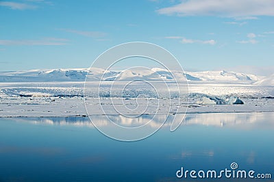 Blue ice in Jokulsarlon glacial lagoon with reflection, Vatnajokull glacier, Iceland Stock Photo