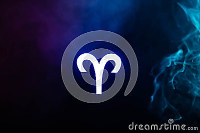 Blue illuminated Aries zodiac sign with smoke Stock Photo