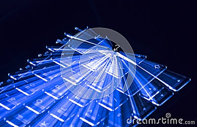 Blue Illuminated Keyboard, Light Trails Around Enter Key, Black Background Stock Photo