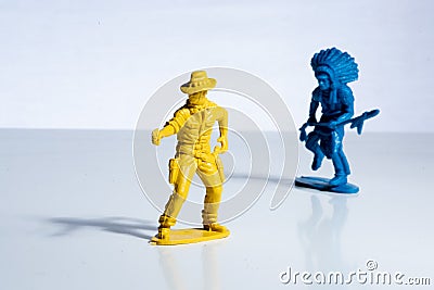 Blue indian and yellow cowboy plastic toy figures Stock Photo