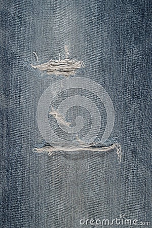 Blue jeans canvas ripped damaged for background Stock Photo