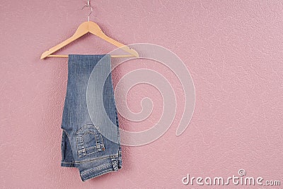 A blue jeans are on hanger. Stock Photo