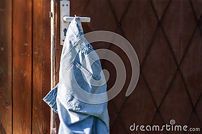 blue jeans hanging on the handle Stock Photo