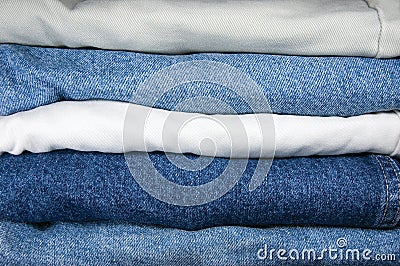 Blue And Khaki Jeans Stack Closeup Stock Photo