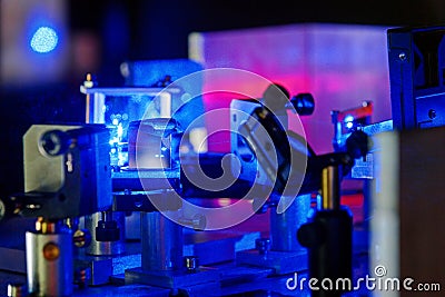 Blue laser in a quantum optics lab. Stock Photo