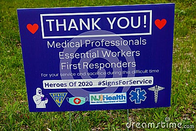 A blue lawn sign giving thanks to medical professionals for their service during the pandemic Editorial Stock Photo